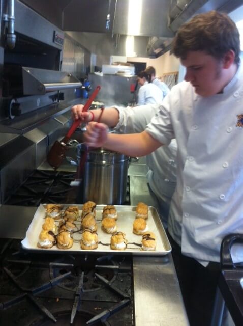 John helping to make chocolate eclair